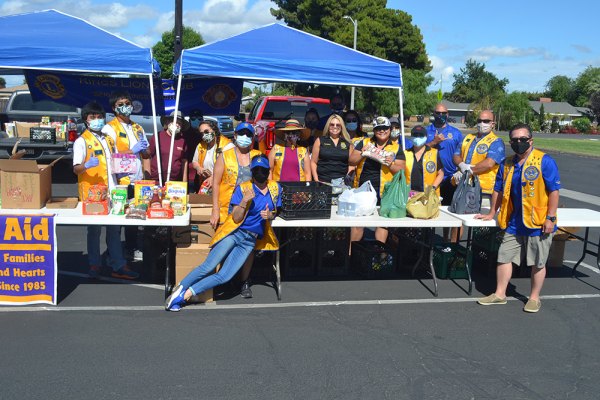 Lemoore's Kings Lions Club hosted a community food drive Saturday morning to benefit Lemoore Christian Aid. Both groups were on hand as local drivers dropped off food.